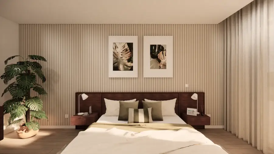 Quarto com cabeceira em madeira e quadros botânicos