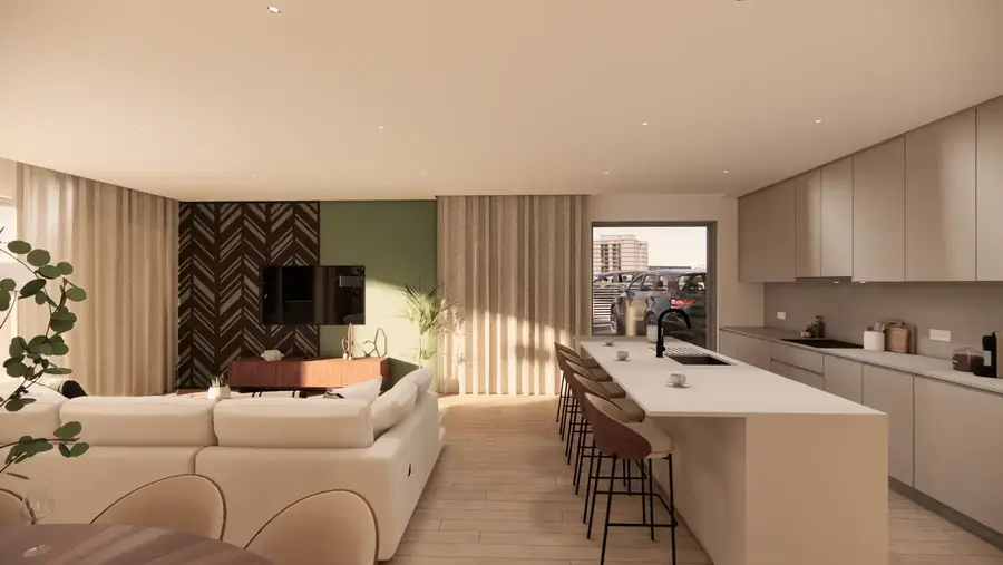 Sala com sofá em L e cozinha ao fundo